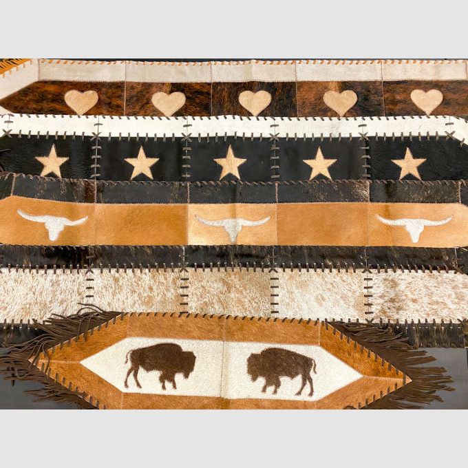 Fringed and Laced Cow Hide Runners available at Rustic Ranch Furniture and Decor.