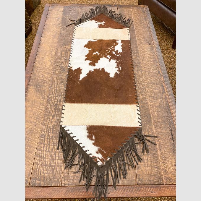 Fringed and Laced Cow Hide Runners available at Rustic Ranch Furniture and Decor.