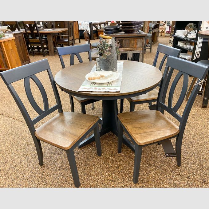 Landocken Round Pedestal Table available at Rustic Ranch Furniture and Decor.