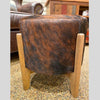 Round Cow Hide Century Foot Stool available at Rustic Ranch Furniture and Decor.
