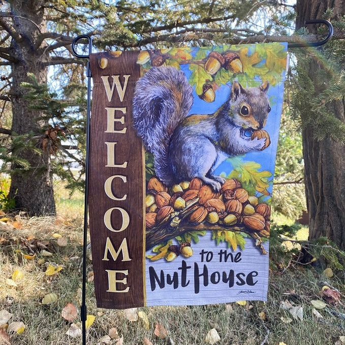 Welcome to the Nuthouse Garden Flag available at Rustic Ranch Furniture in Airdrie, Alberta