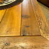 Close-up of a wooden coffee table with visible grain and texture. Sequoia Coffee Table available at Rustic Ranch Furniture and Decor.