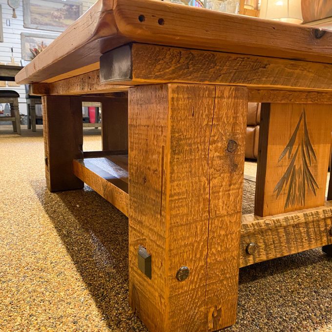 Wooden coffee table with rustic design in an indoor setting. Sequoia Coffee Table available at Rustic Ranch Furniture and Decor.