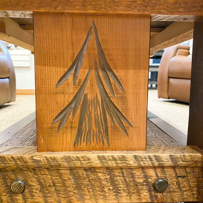 Wooden coffee table with a sequoia tree design in a casual indoor setting. Sequoia Coffee Table available at Rustic Ranch Furniture and Decor.