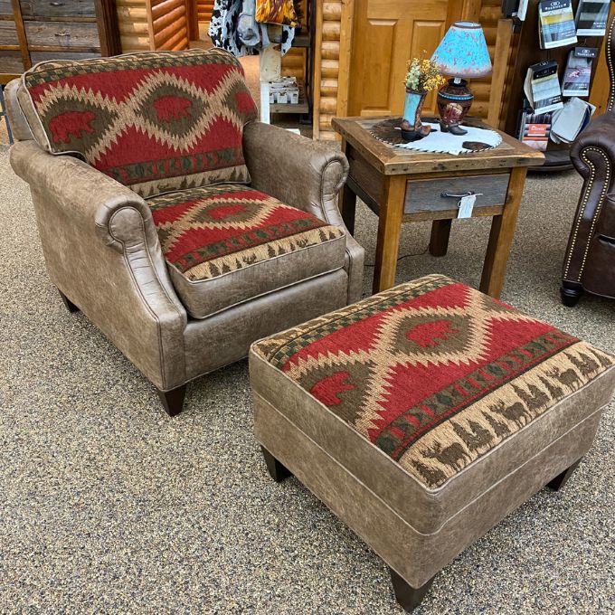 Chair and ottoman with patterned cushions in a store setting. Charles Chair and Ottoman available at Rustic Ranch Furniture and Decor.