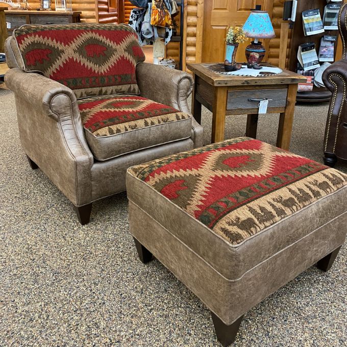 Chair and ottoman with patterned cushions in a furniture store setting. Charles Chair and Ottoman available at Rustic Ranch Furniture and Decor.