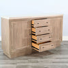 Wooden cabinet with open drawers on a wooden floor. Rowan Buffet available at Rustic Ranch Furniture and Decor.