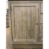 Wooden cabinet with a closed door on a neutral background. Rowan Buffet available at Rustic Ranch Furniture and Decor.