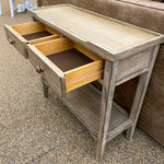 Wooden side table with open drawers against a neutral background. Beach Pebble Side Table available at Rustic Ranch Furniture and Decor.