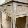 Wooden side table with drawers and a shelf.Beach Pebble Side Table available at Rustic Ranch Furniture and Decor.