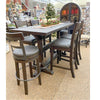 Wooden dining table with chairs in a store setting. Homestead Pub Table available at Rustic Ranch Furniture and Decor.