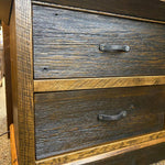Wooden dresser with two drawers and metal handles on a textured surface. Fireside Nightstand available at Rustic Ranch Furniture and Decor.