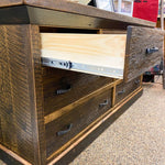 Wooden dresser with open drawer showing metal slide mechanism. Fireside Reclaimed Wood Seven Drawer Dresser available at Rustic Ranch Furniture and Decor.