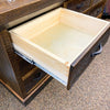 Wooden drawer with a metal handle on a wooden cabinet. Fireside Reclaimed Wood Seven Drawer Dresser available at Rustic Ranch Furniture and Decor.
