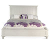 White bed with purple floral bedding on a white background.  Carriage House Bed - King and Queen Sizing available at Rustic Ranch Furniture and Decor.