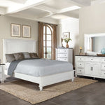 Neatly arranged bedroom with white furniture, including a bed, dresser, and mirror.  Carriage House Bed - King and Queen Sizing available at Rustic Ranch Furniture and Decor.