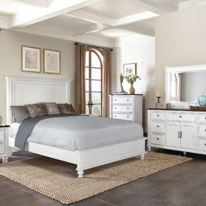 Neatly arranged bedroom with white furniture, including a bed, dresser, and mirror.  Carriage House Bed - King and Queen Sizing available at Rustic Ranch Furniture and Decor.