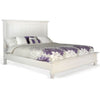 White bed with floral bedding on a white background.  Carriage House Bed - King and Queen Sizing available at Rustic Ranch Furniture and Decor.