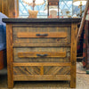 Wooden nightstand with two drawers in a bedroom setting. Jackson Hole Reclaimed Wood Nightstand available at Rustic Ranch Furniture and Decor.