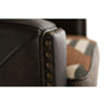Close-up of a brown leather armchair with buttoned details.  Hollister Chair at Rustic Ranch Furniture and Decor.
