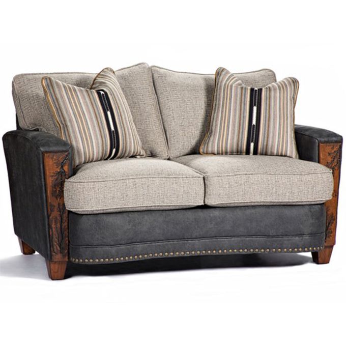 Two-seater sofa with striped cushions on a white background. The Hollister Love Seat available at Rustic Ranch Furniture and Decor.