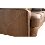 Close-up of a brown leather sofa with visible stitching details.  The Hollister Sofa is available at Rustic Ranch Furniture and Decor.