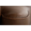 Close-up of a brown leather surface with a subtle texture.   The Hollister Sofa is  available at Rustic Ranch Furniture and Decor.