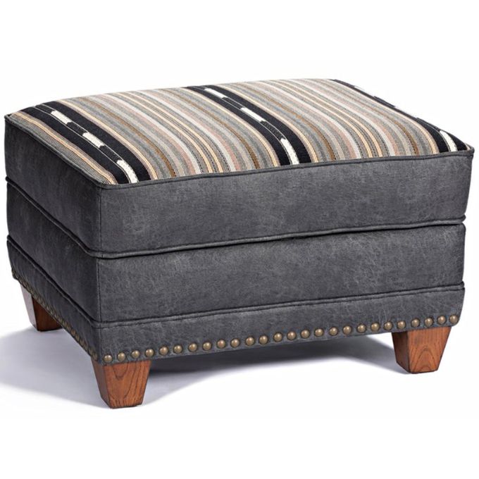 Gray ottoman with striped cushion on a white background. Hollister Ottoman available at Rustic Ranch Furniture and Decor.