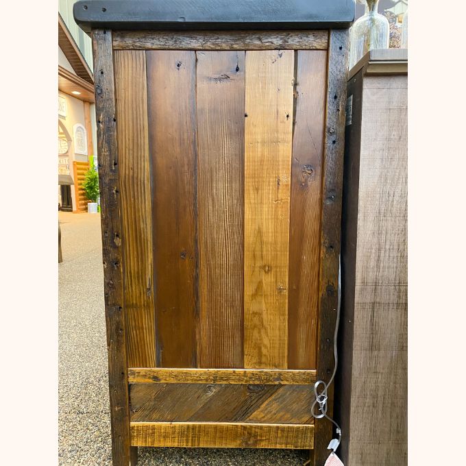 Wooden cabinet with a rustic design in an indoor setting.  Jackson Hole Four Door Sideboard available at Rustic Ranch Furniture and Decor.