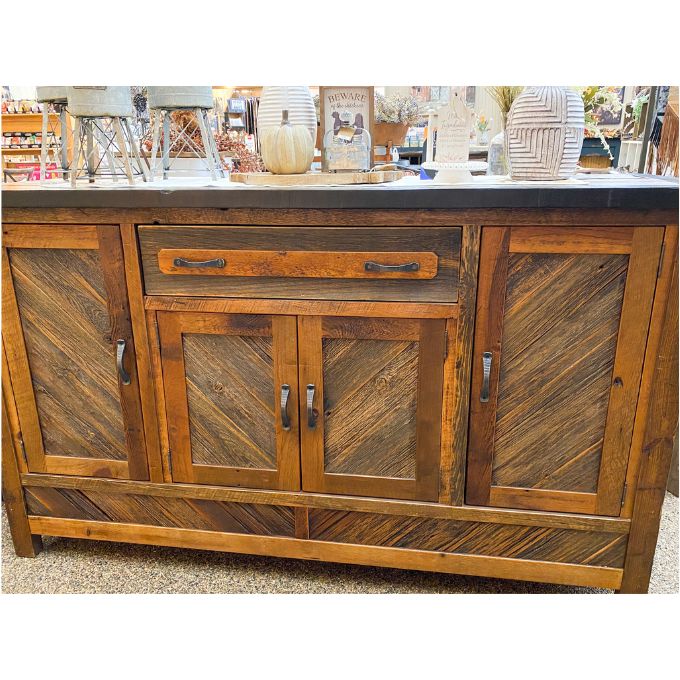 Wooden sideboard in a store setting.  Jackson Hole Four Door Sideboard available at Rustic Ranch Furniture and Decor.