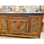 Wooden sideboard with a rustic design in an indoor setting.  Jackson Hole Four Door Sideboard available at Rustic Ranch Furniture and Decor.