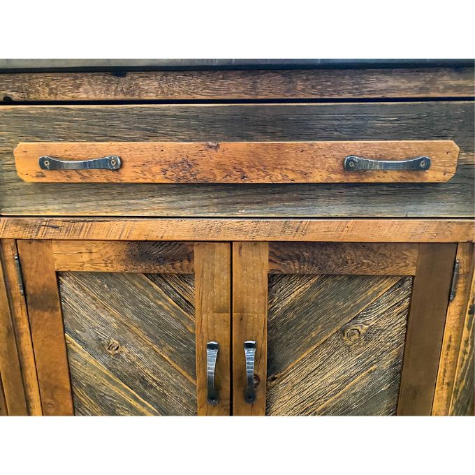 Wooden cabinet with rustic design and metal handles on a white background.  Jackson Hole Four Door Sideboard available at Rustic Ranch Furniture and Decor.