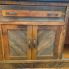 Wooden cabinet with two doors and metal handles.  Jackson Hole Four Door Sideboard available at Rustic Ranch Furniture and Decor.