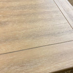 Close-up of a wooden surface with a visible grain pattern. Gianna End Table available at Rustic Ranch Furniture and Decor.