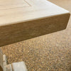 Close-up of a wooden table corner  on Gianna End Table available at Rustic Ranch Furniture and Decor.