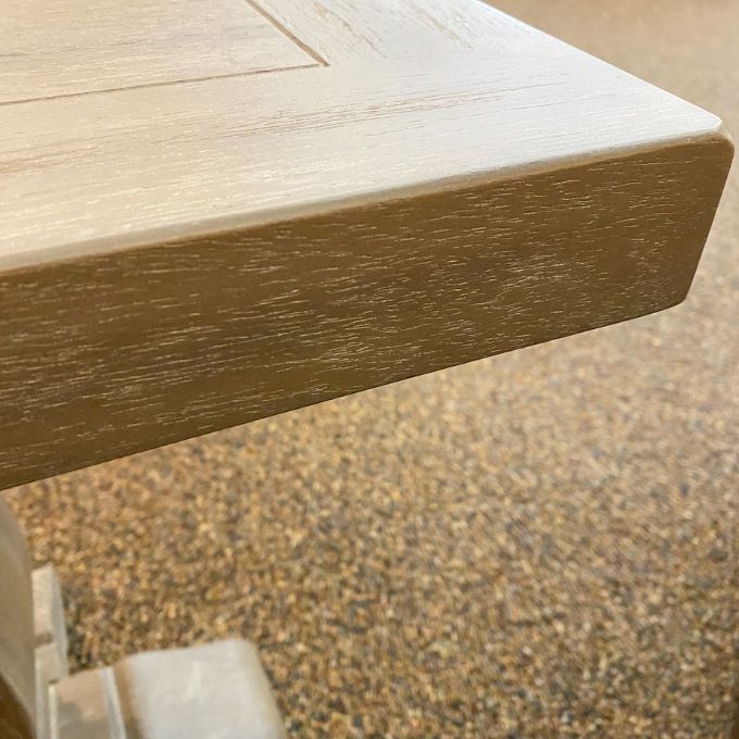 Close-up of a wooden table corner  on Gianna End Table available at Rustic Ranch Furniture and Decor.