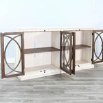 White entertainment console with wooden doors on a gray floor. Pasadena Media Console - 78" available at Rustic Ranch Furniture and Decor.