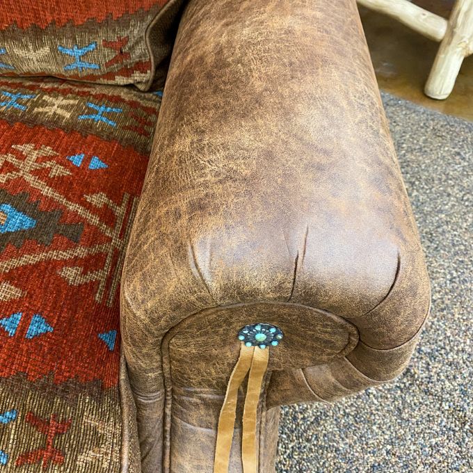 Brown leather chair with decorative elements.  Emerson Chair and a Half available at Rustic Ranch Furniture and Decor.