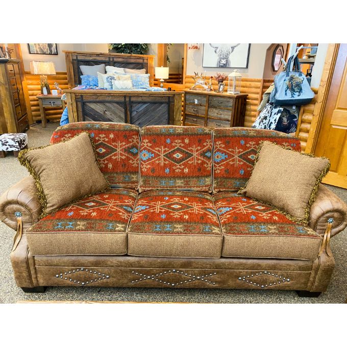 Decorative sofa with patterned cushions in a room setting.  Emerson Sofa available at Rustic Ranch Furniture and Decor.