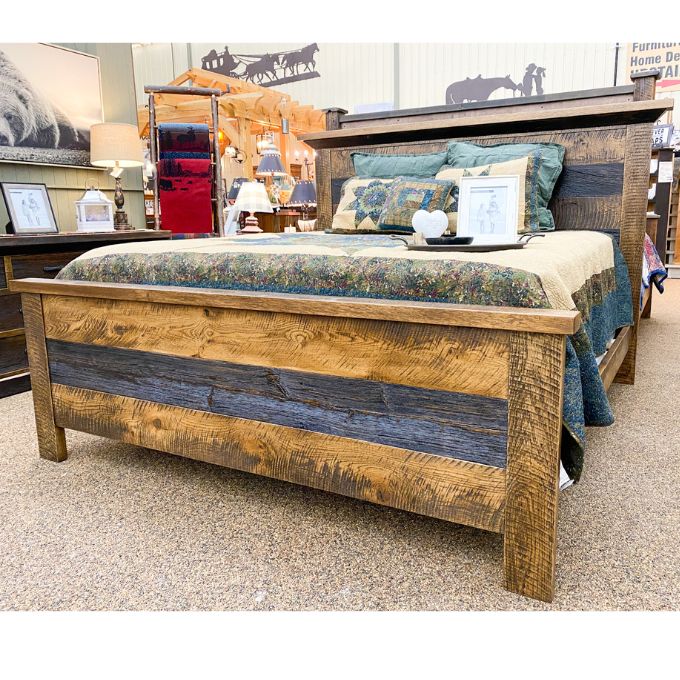Wooden bed with reclaimed wood in a store setting. Fireside bed available at Rustic Ranch Furniture and Decor.
