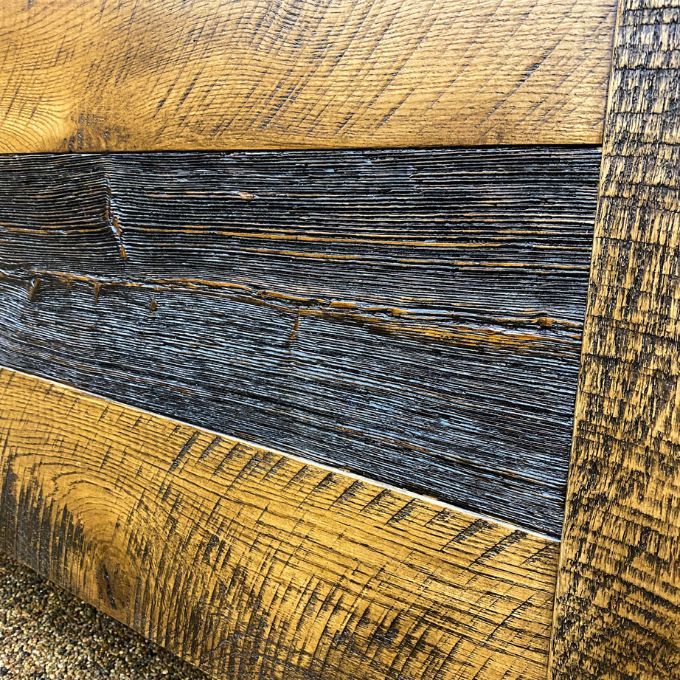 Close-up of wooden planks with a focus on texture and color variation on the Fireside bed available at Rustic Ranch Furniture and Decor.