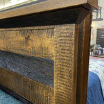 Close-up of a wooden headboard with a rustic finish.  Fireside bed available at Rustic Ranch Furniture and Decor.