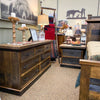 Wooden bedroom furniture in a room with decorative items and wall art. Fireside Reclaimed Wood Seven Drawer Dresser available at Rustic Ranch Furniture and Decor.