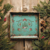 Decorative tray with floral and nature-themed design on a wooden background with greenery. La Folie Paint Inlay by IOD - Limited Edition available at Rustic Ranch Furniture and Decor.