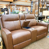 Brown leather recliner love seat with cup holders in a store setting.  Vienna Reclining Love Seat available at Rustic Ranch Furniture and Decor.