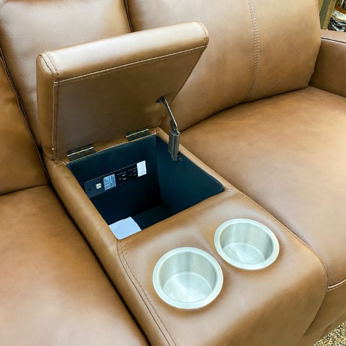 Brown leather love seat with cup holders and a small table extension.  Vienna Reclining Love Seat available at Rustic Ranch Furniture and Decor.