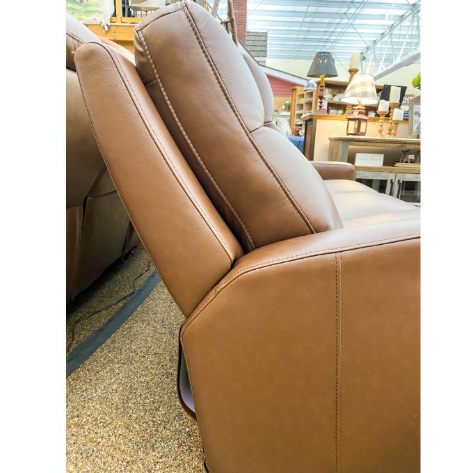 Brown leather recliner love seat in a showroom setting.  Vienna Reclining Love Seat available at Rustic Ranch Furniture and Decor.
