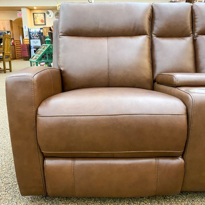 Brown leather recliner love seat in a store setting.  Vienna Reclining Love Seat available at Rustic Ranch Furniture and Decor.