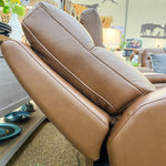 Close-up of a brown leather recliner love seat in a living room setting.  Vienna Reclining Love Seat available at Rustic Ranch Furniture and Decor.