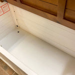 Wooden storage chest with a white interior. White Dashbury Storage Trunk available at Rustic Ranch Furniture and Decor.